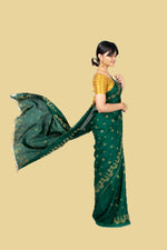 Load image into Gallery viewer, deep green golden goose saree close-up of golden embroidered detail