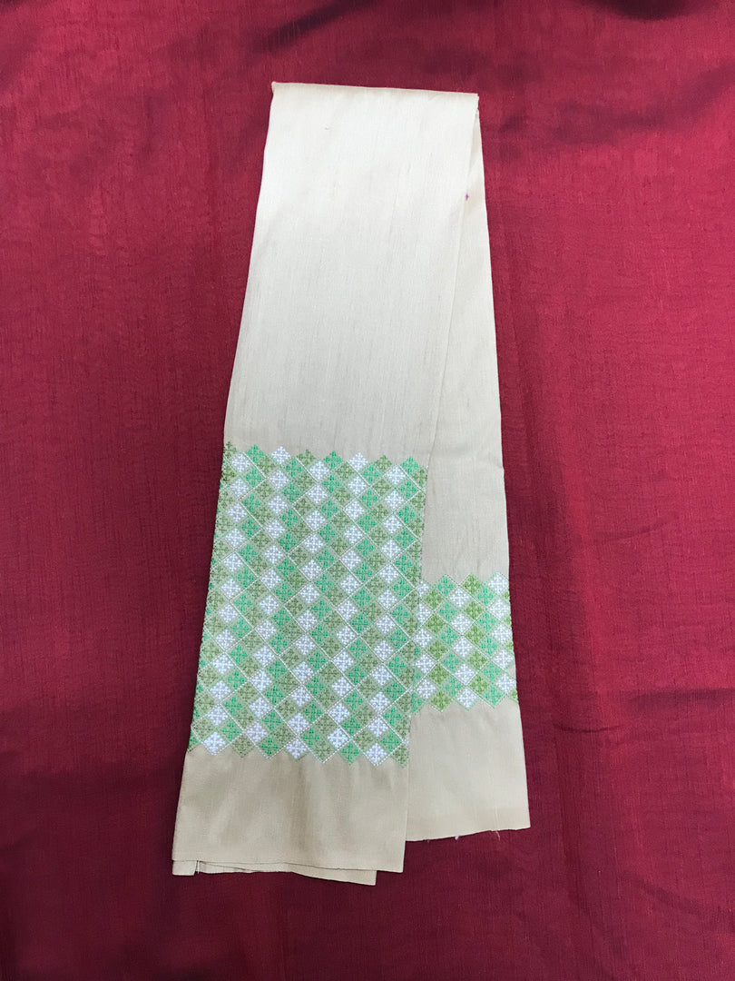 Cream banjara work blouse with embroidered motifs and mirror accents