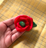 Load image into Gallery viewer, Close-up of three kasuti rose clips with floral embroidery detail