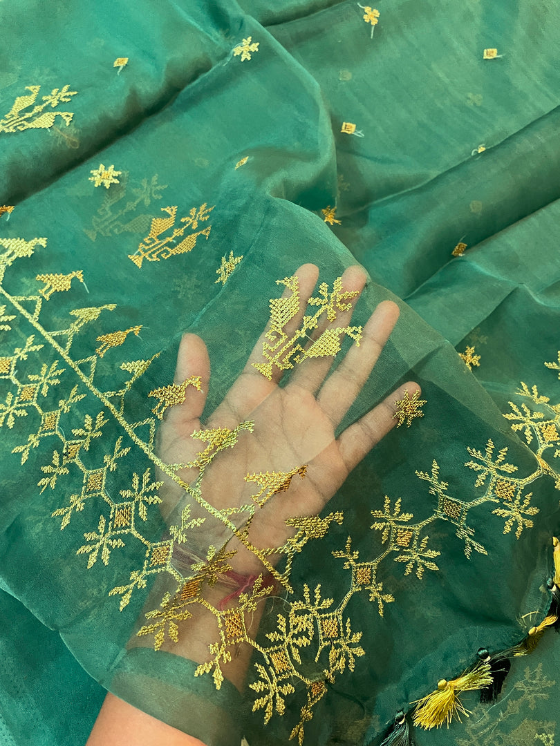 green mayur organza kasuti saree showing embroidery across fabric