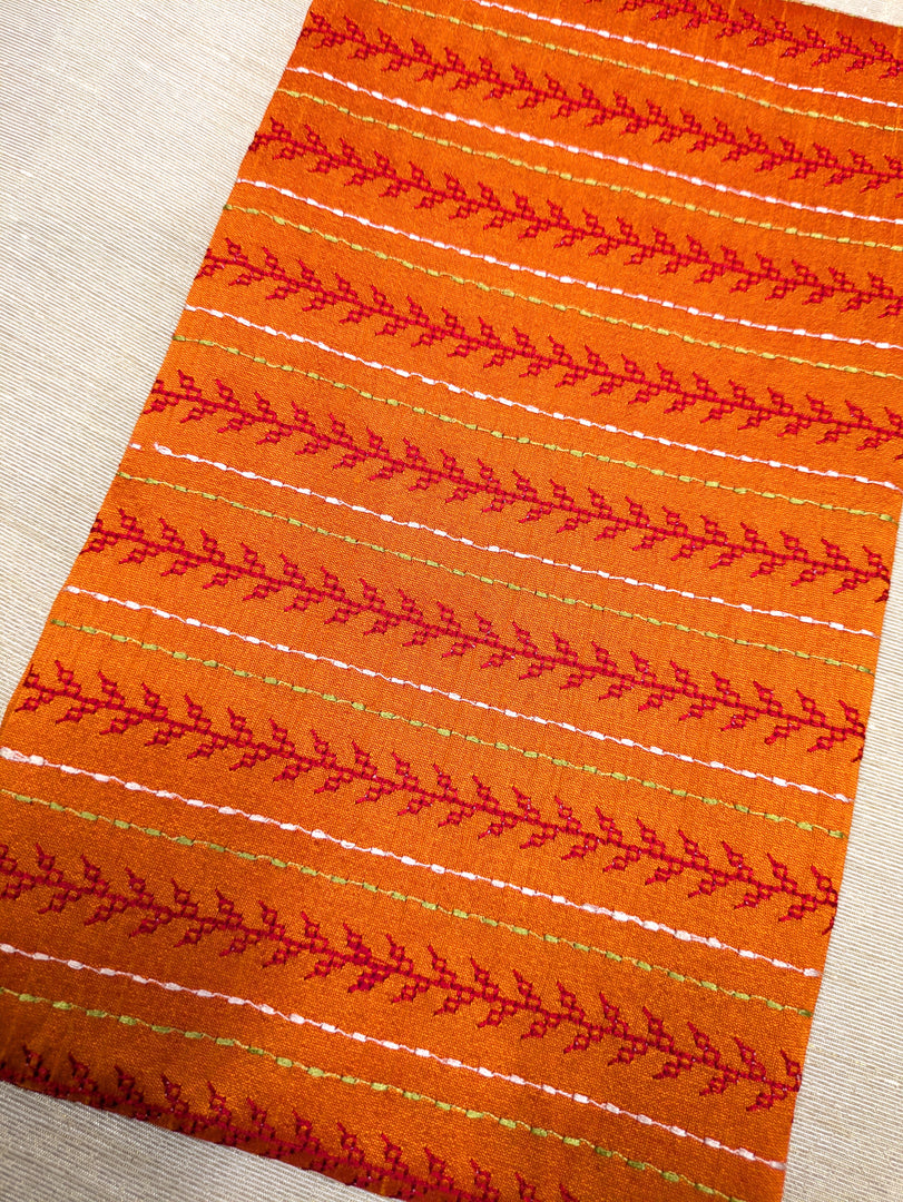 Orange kasuti blouse with traditional village embroidery front
