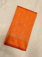 Load image into Gallery viewer, close-up detail of embroidered diamond motifs on orange kutchwork blouse