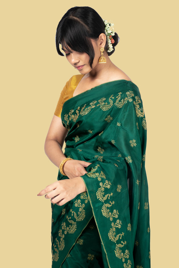 deep green golden goose saree draped front view with zari detail