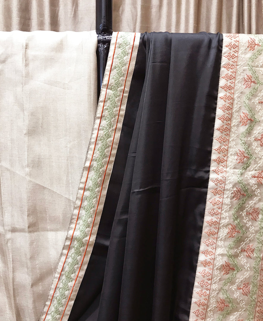 Midnight black maharani border saree close-up of embroidered border