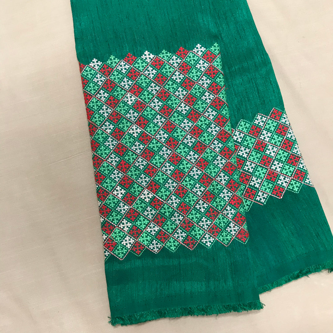 Green banjara work blouse close-up with mirror and thread embroidery