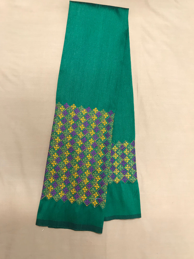 Green banjara work blouse detailed embroidery close-up with mirror accents