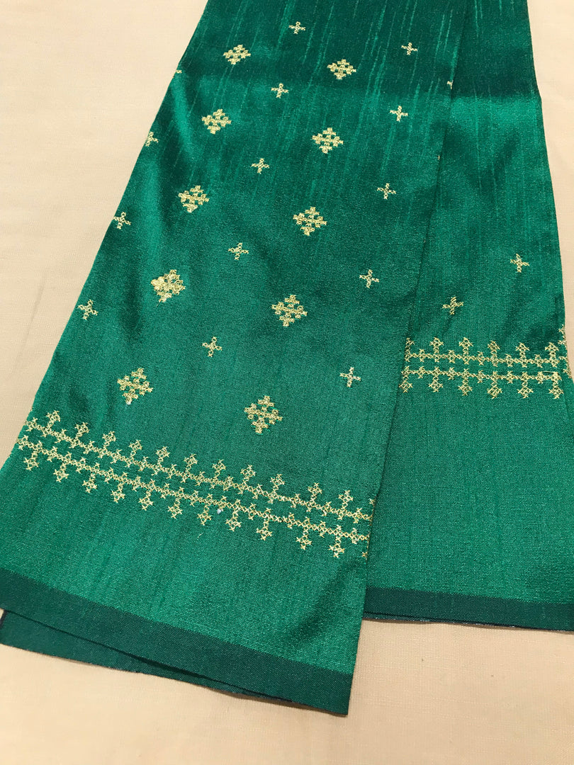 Green diamond kutchwork blouse embroidery close-up with diamond motifs