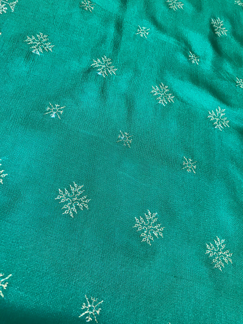 Green saree with golden goose motifs and zari woven border