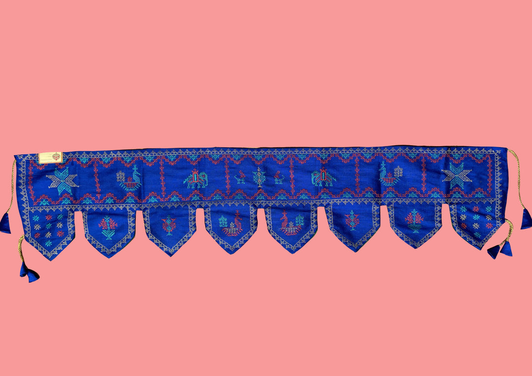 Blue kubera toran shown in close-up with fabric stitch detail
