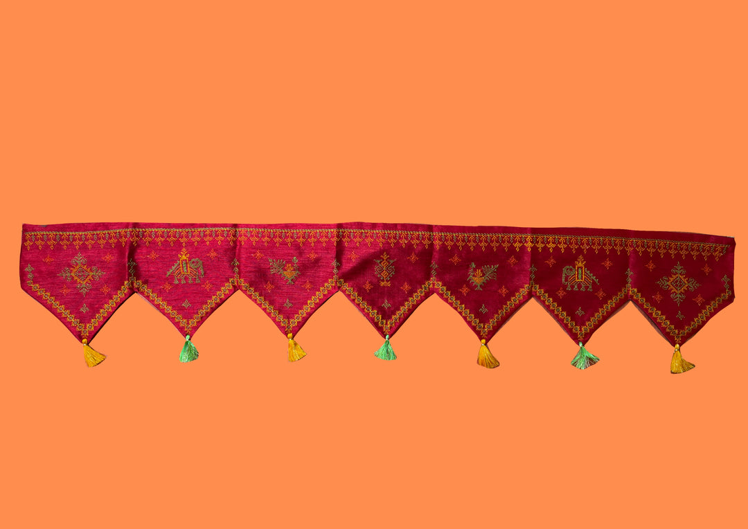 Maroon kasuti toran shown in close-up with detailed motifs