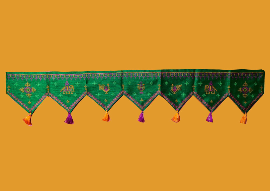 Green kasuti toran shown in close-up with fabric stitchwork