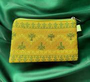 Haldi yellow maharani purse with ornate embroidery and tassel cords