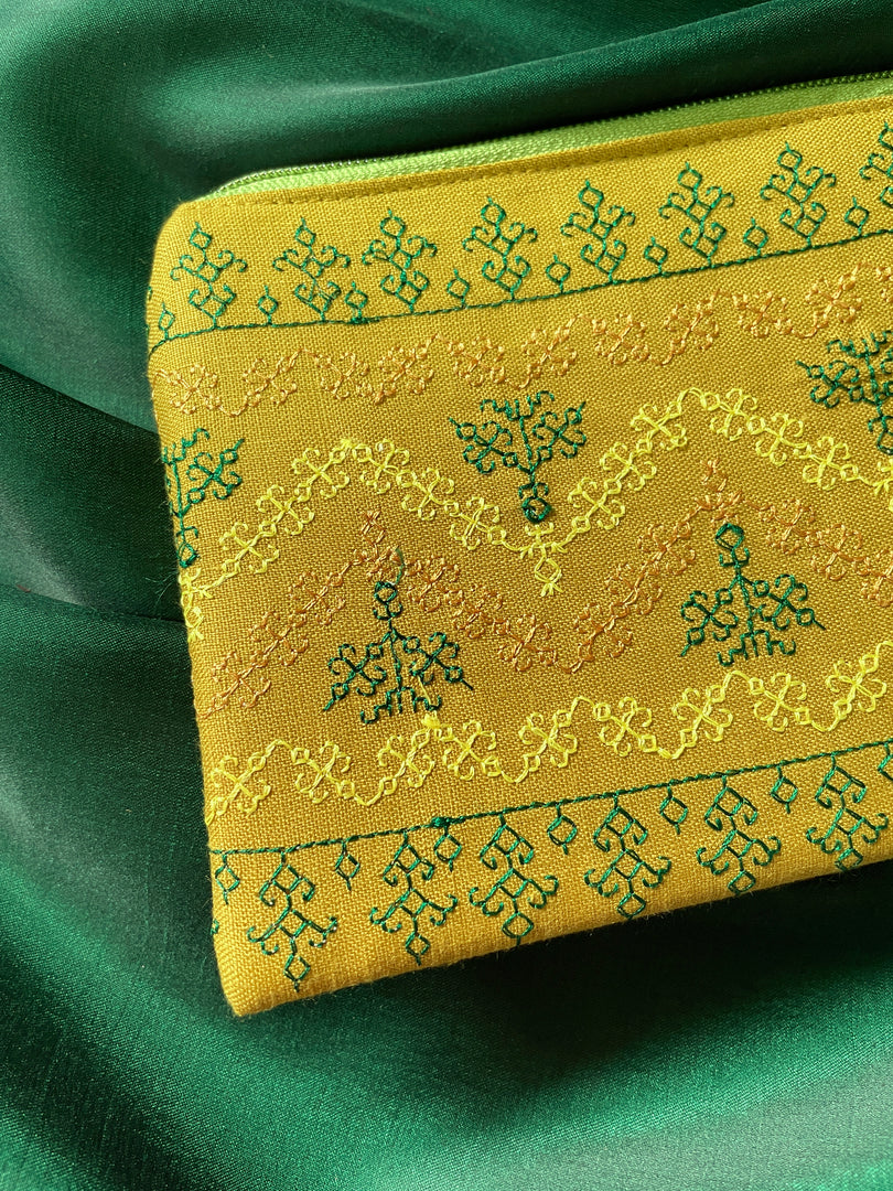 Embroidered haldi maharani purse showing floral detail and closure