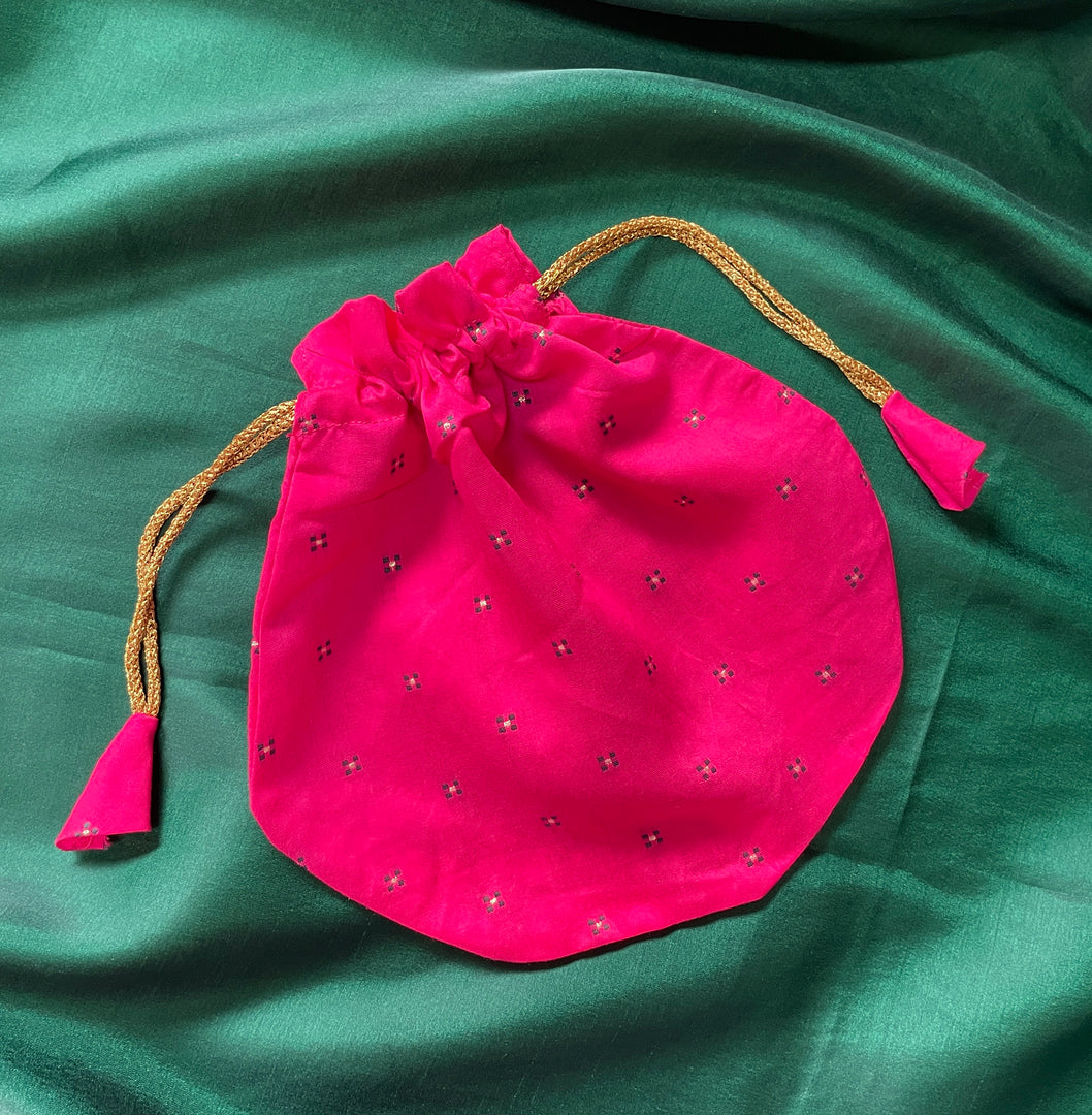 Red embroidered butti potli with floral motifs and drawstring top