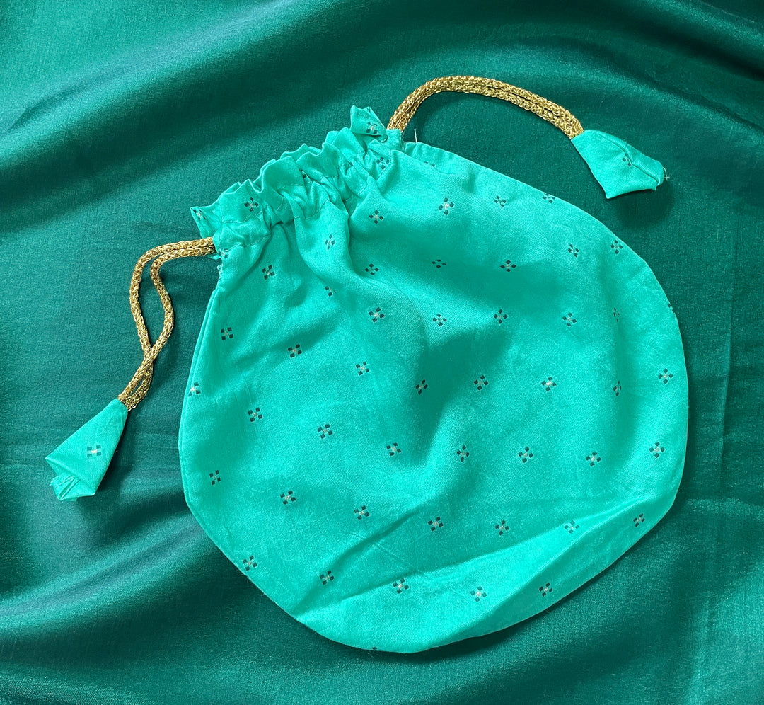 Pink butti potli bag with embroidered details and cord closure