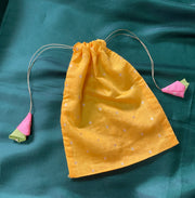 Set of embroidered butti potlis in assorted colours with drawstrings