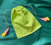 Yellow potli bag showcasing floral embroidery and drawstring finish