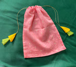 Load image into Gallery viewer, Blue embroidered potli bag featuring floral motifs and golden drawstring
