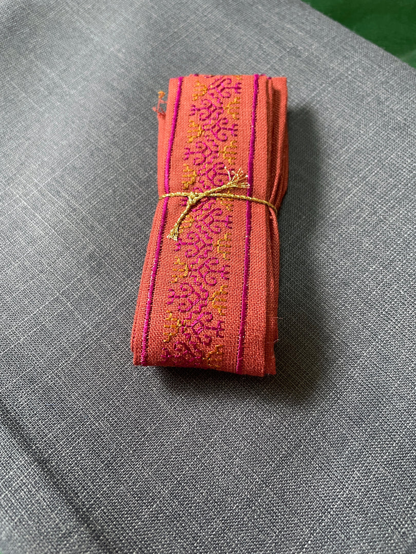 Pink tulsi men’s kurta fabric piece showing woven texture and fine detail