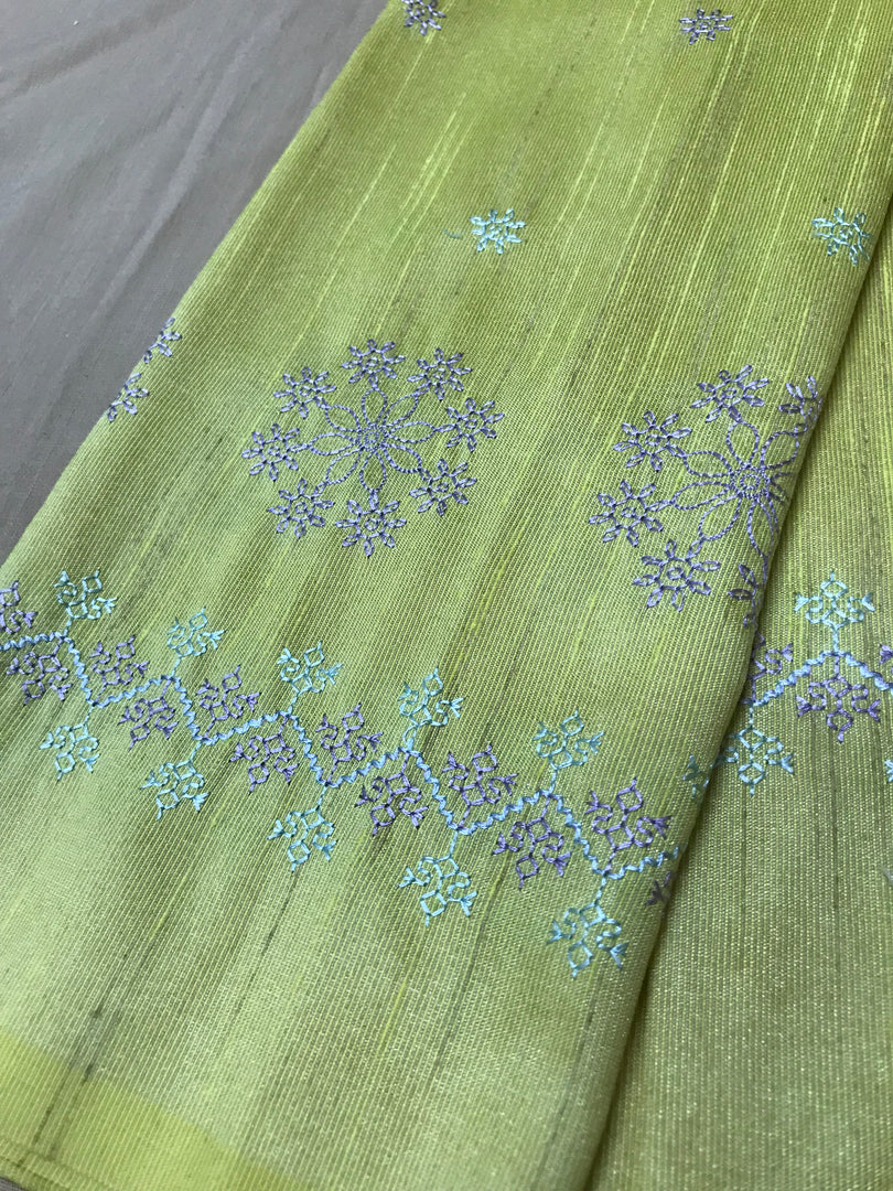 Lemon yellow parijat blouse piece side view showing embroidered detail
