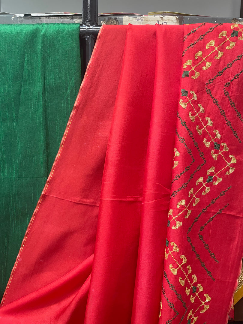 Drape of orange paisley temple saree highlighting border weave