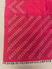 Close-up of orange paisley temple saree embroidery on border