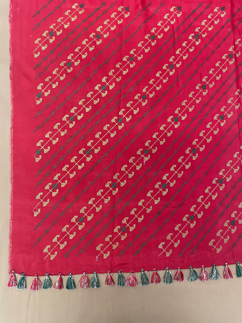Border and paisley embroidery detail of orange temple saree