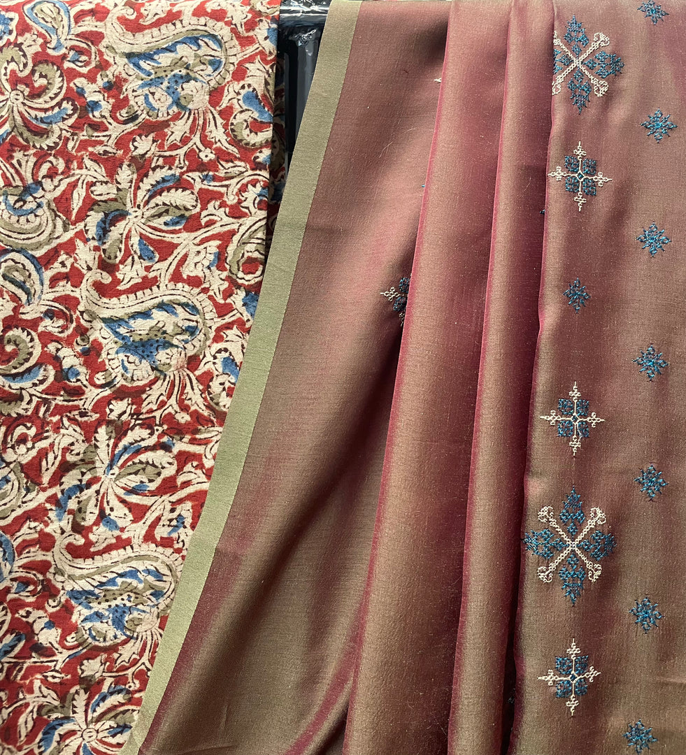 Mehendi green flora butti saree paired with brick red blouse