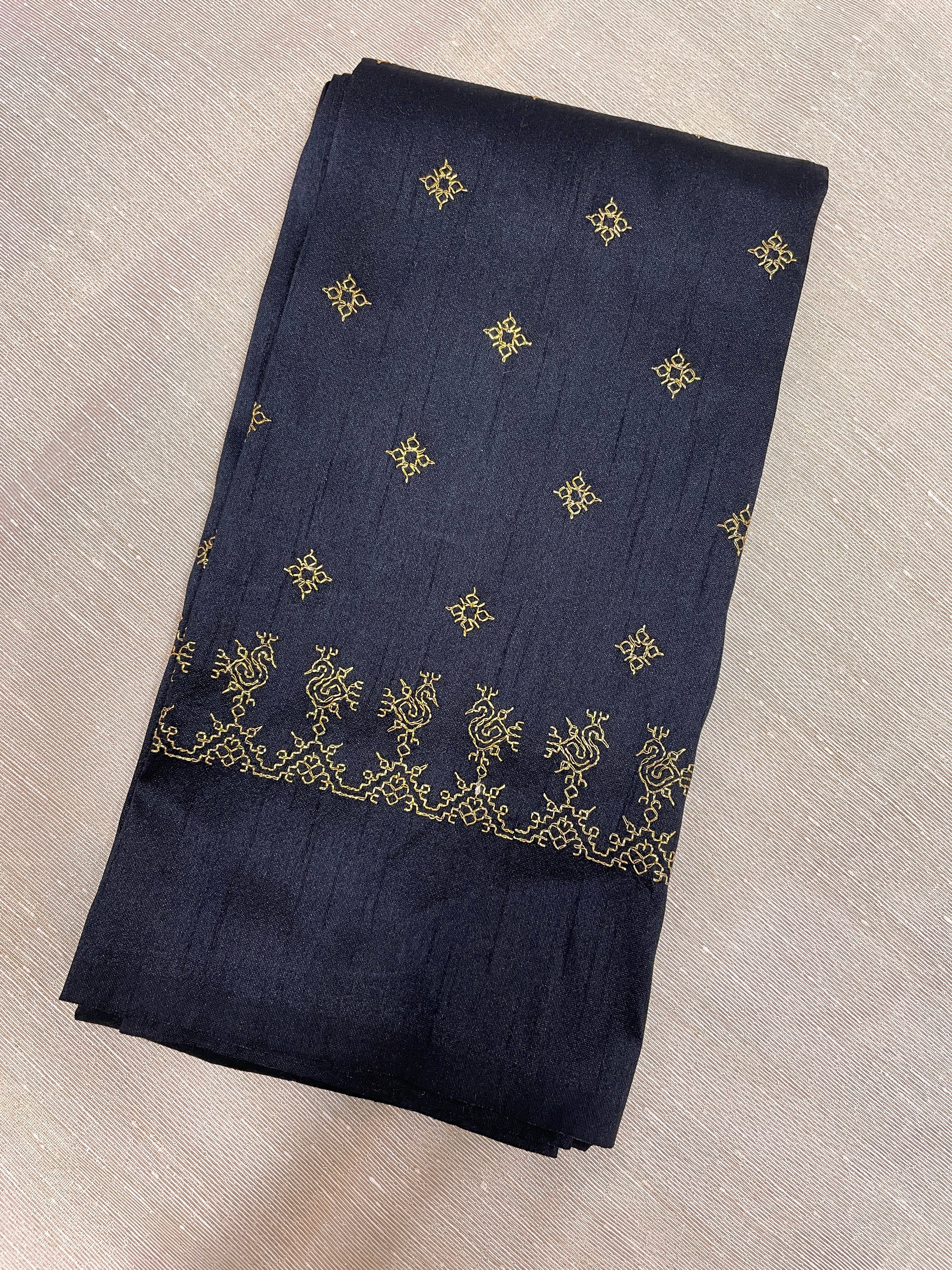 Black peacock kasuti blouse close-up showing embroidered peacock motifs