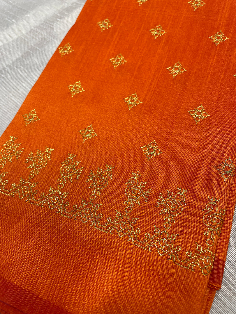 Dark orange blouse with peacock motif and gold zari embroidery