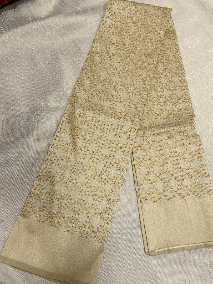 Hand embroidery close-up on beige kasuti bloom blouse
