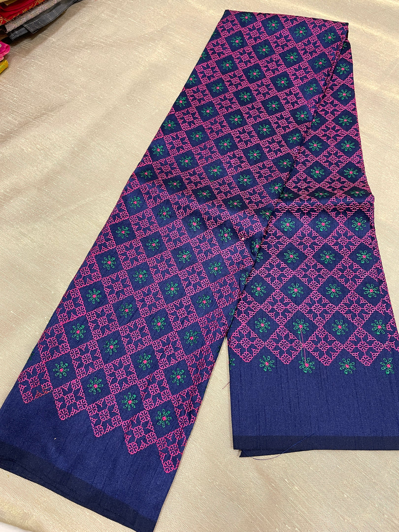 Close-up of kasuti threadwork on navy blue embroidered blouse