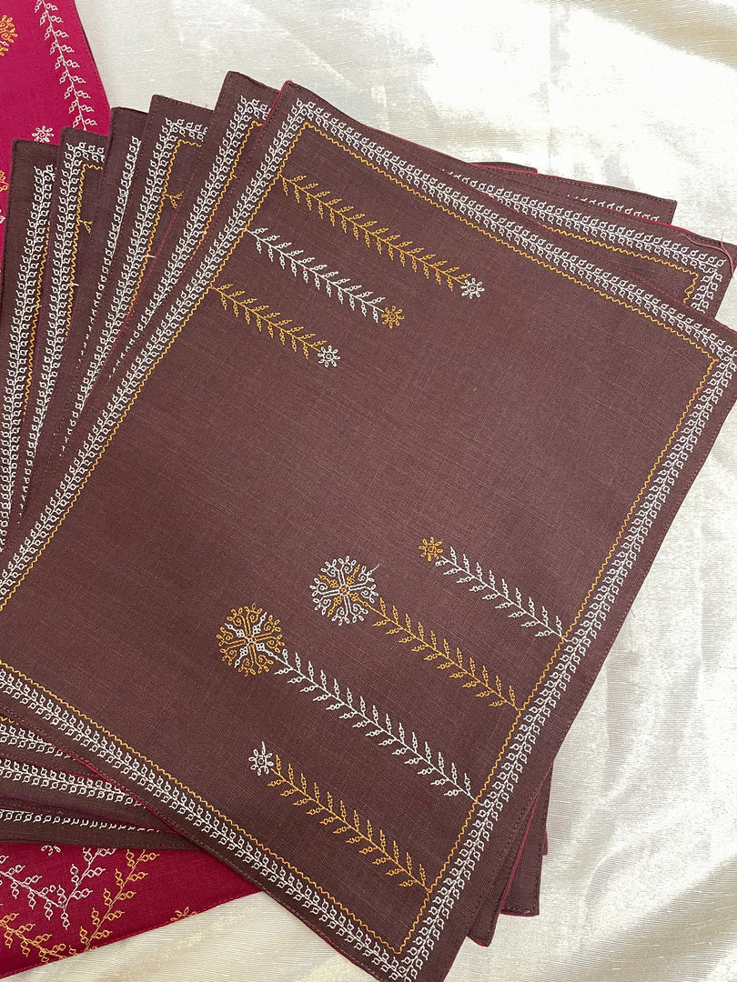 Woven cotton badige moggu kasuti table set showing embroidered motifs