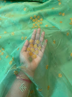 Load image into Gallery viewer, green organza kasuti saree showing floral embroidery on sheer drape
