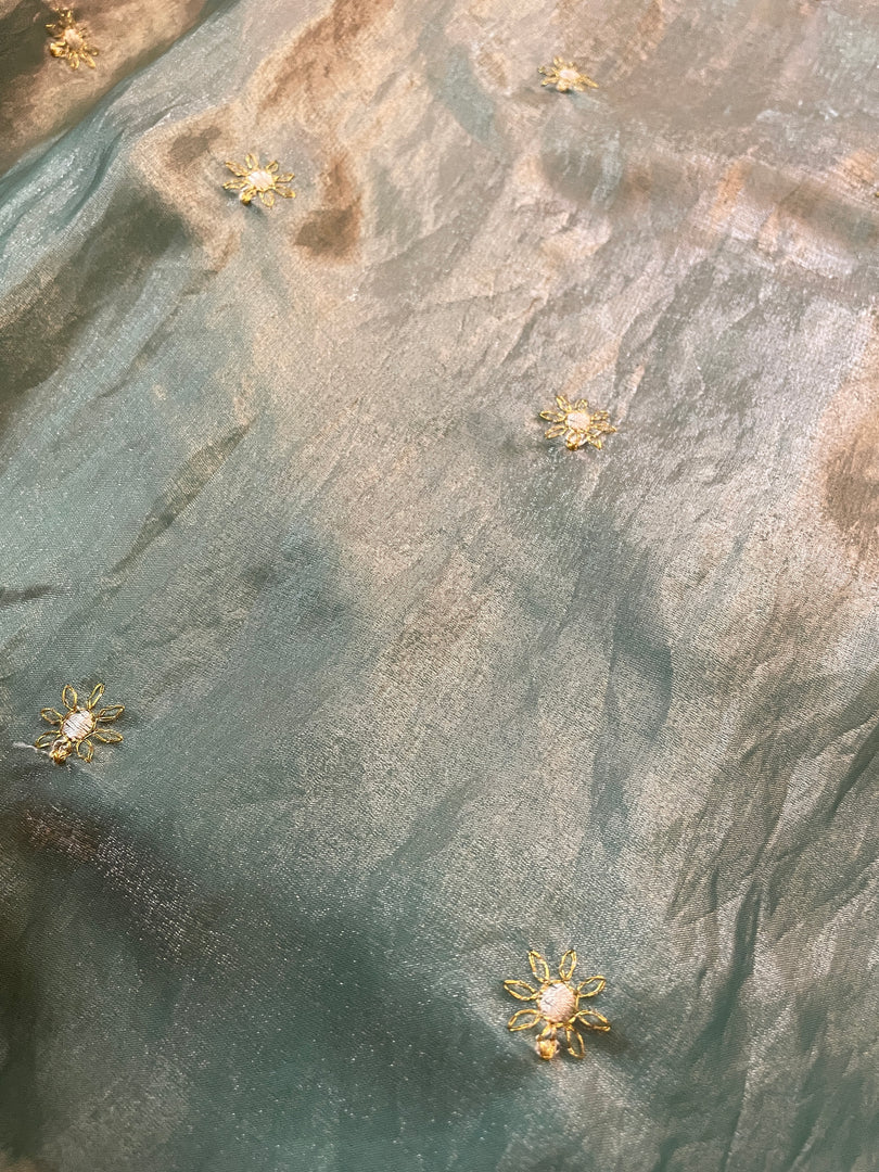 jade flora glass organza saree showing embroidered floral pattern