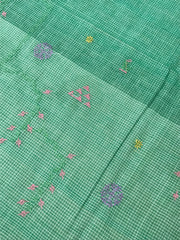 Green kasuti forest saree in cotton showing embroidered leafy motifs