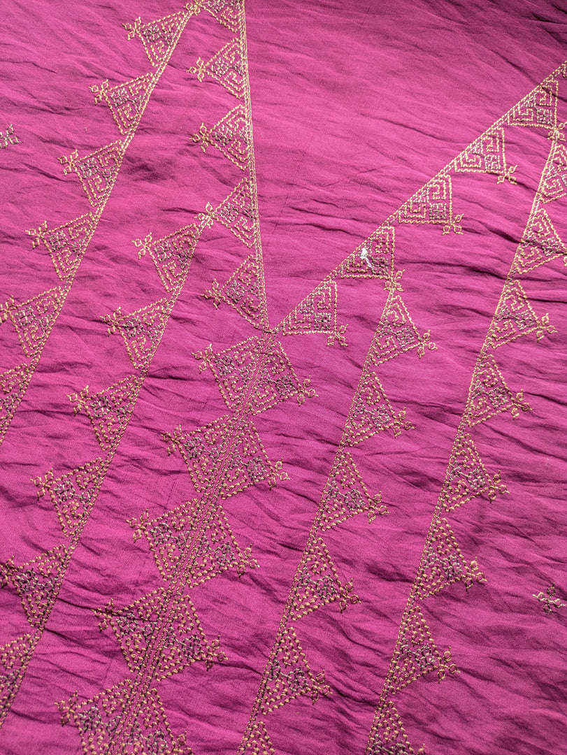 Deep pink kasuti kurti with close-up embroidery on yoke