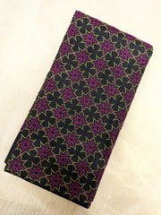 Embroidery detail on black antara kasuti blouse with floral motifs