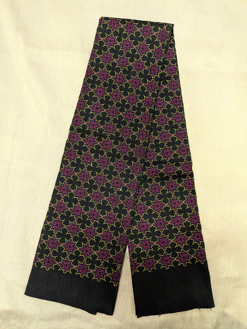 Back view of black antara kasuti blouse featuring kasuti embroidery