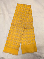 Embroidery detail on yellow antara kasuti blouse with floral motifs