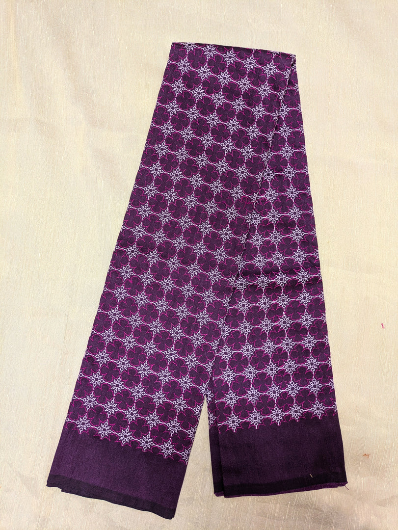 Embroidery close-up on purple antara kasuti blouse with floral design