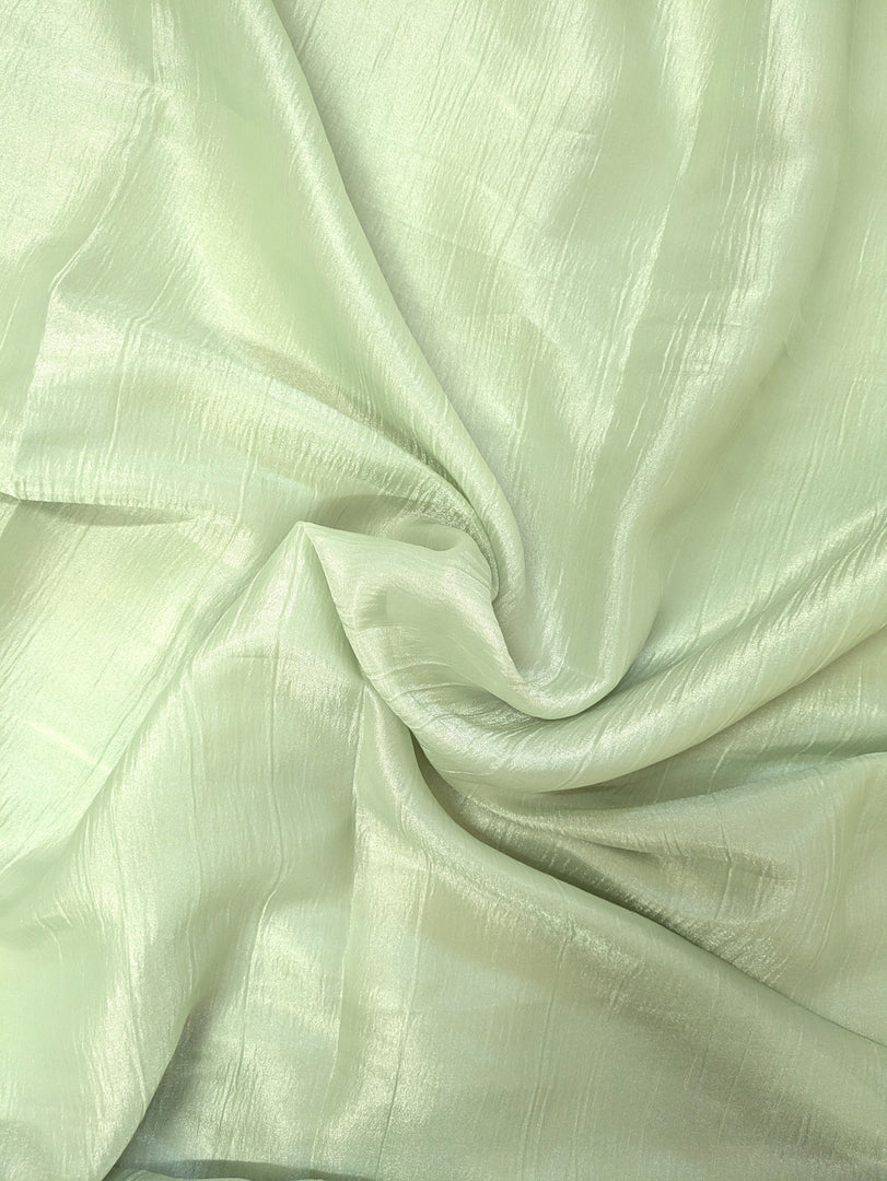 Pallu view of pista kanakambara saree paired with kasuti embroidered blouse