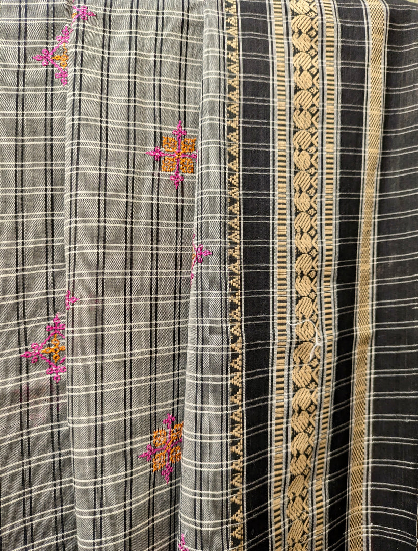 Folded view of grey malini kasuti handwoven cotton saree with woven texture