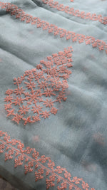 Load image into Gallery viewer, organza saree in pista shade kasuti petal embroidery border detail
