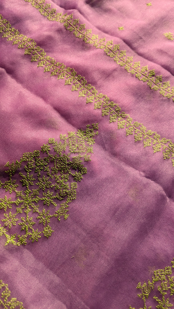 lilac organza kasuti saree showing floral embroidery on sheer fabric