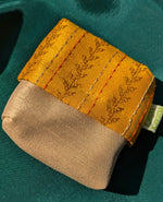 Load image into Gallery viewer, tapi ganga jamuna purse highlighting striped weave and stitched edges
