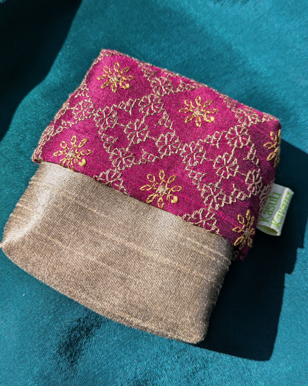 narmada ganga jamuna purse showing striped weave and stitched detailing