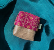 narmada ganga jamuna purse with handwoven striped fabric and textured body