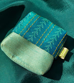 Load image into Gallery viewer, krishna ganga jamuna purse with striped handwoven fabric close-up
