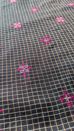 Load image into Gallery viewer, malini kasuti handwoven saree in black shade fabric display

